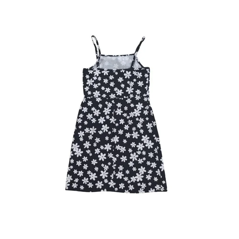 art class. Girls black and white floral print dress and white shirt sleeve. NWT
